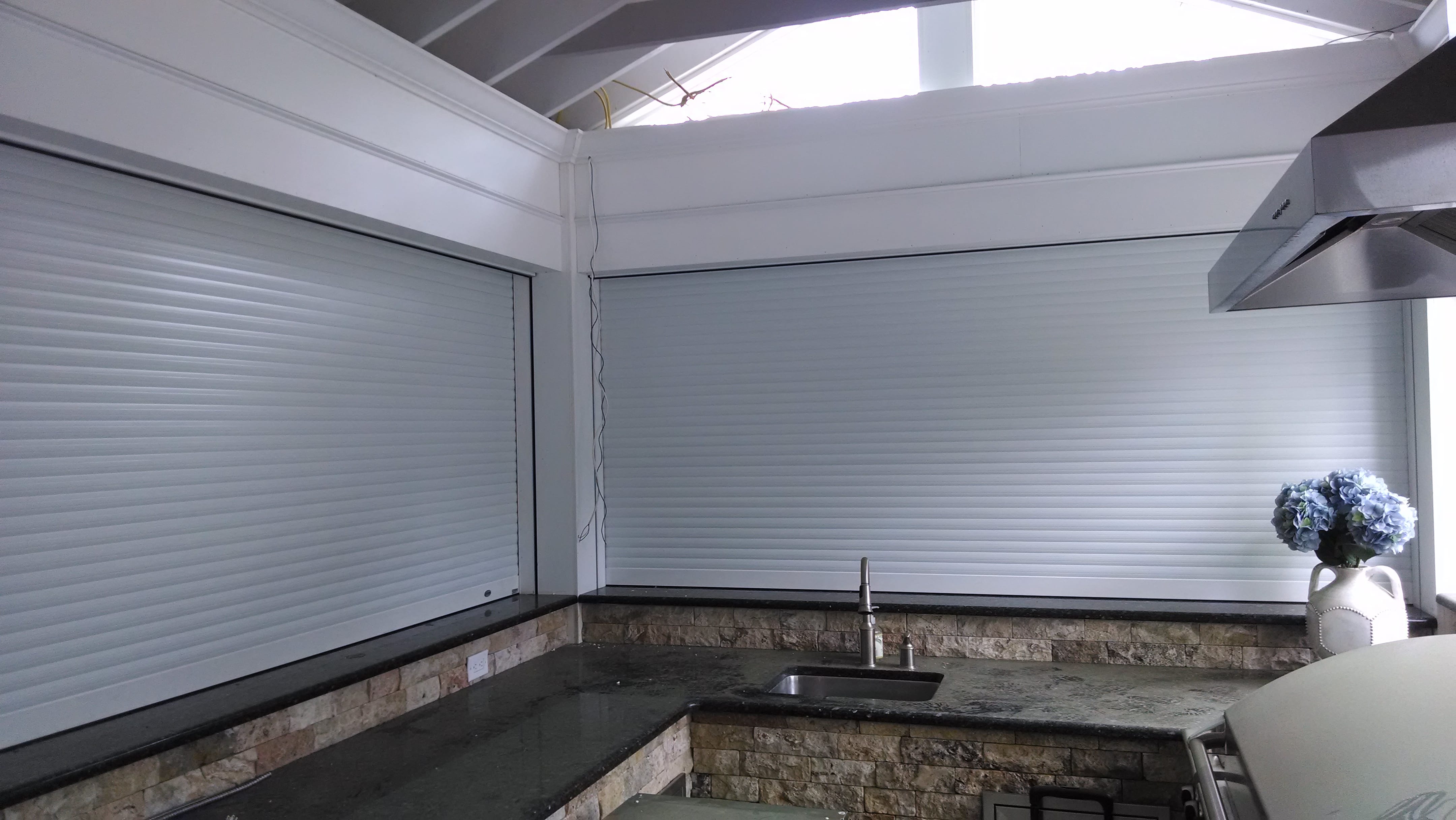 Pentagon Security Shutter protects outdoor kitchen inside view Broadview Screen